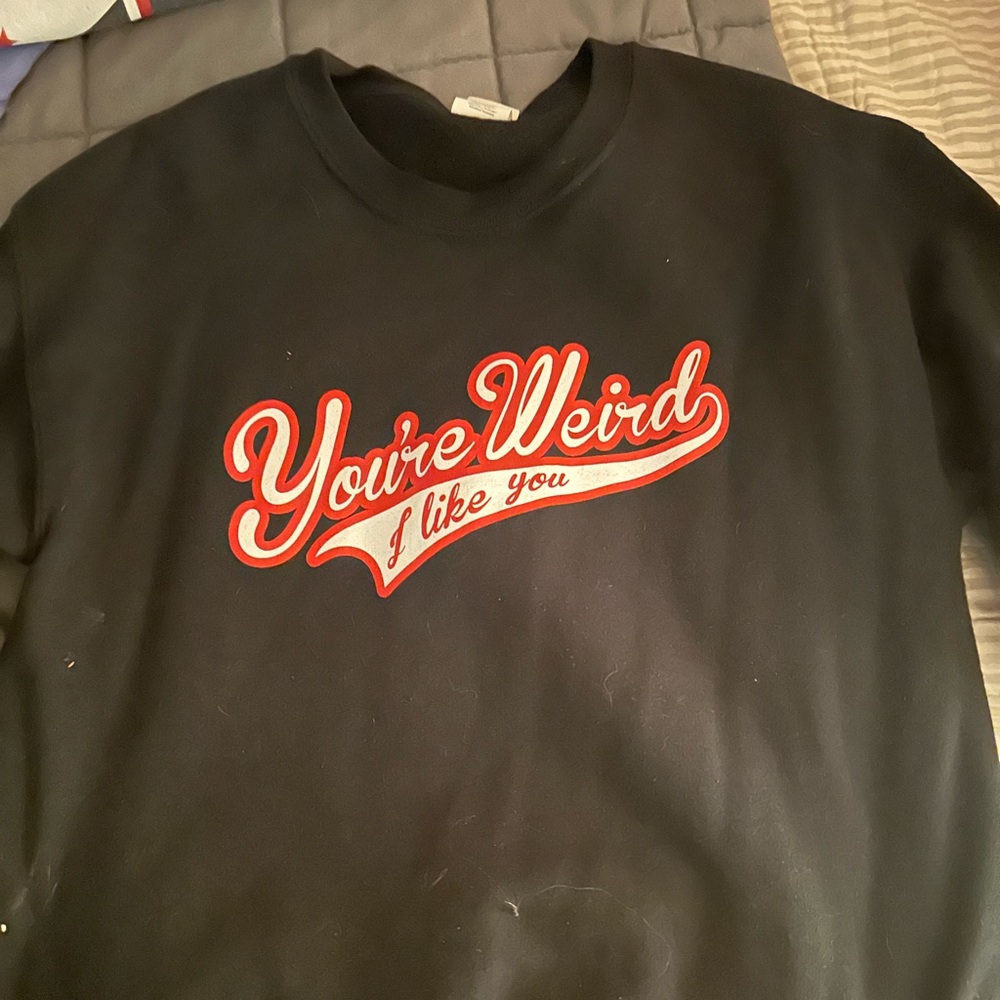 Black crewneck reading, “You’re Weird. I like you.” Worn once.